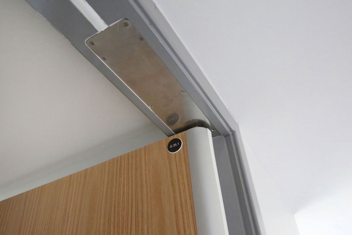 Integral finger guard with door closer Designs out the problem